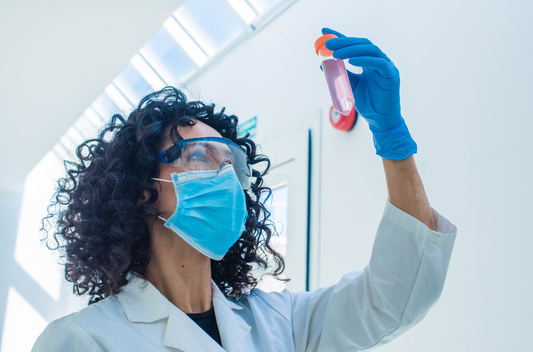 Quality analyst testing chemicals in a chemical wholesale lab